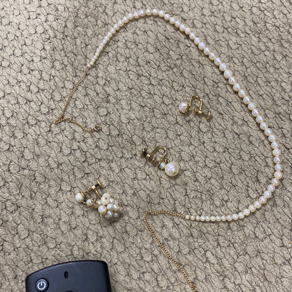14k pearl necklace and than the darling are pearls but gold plated